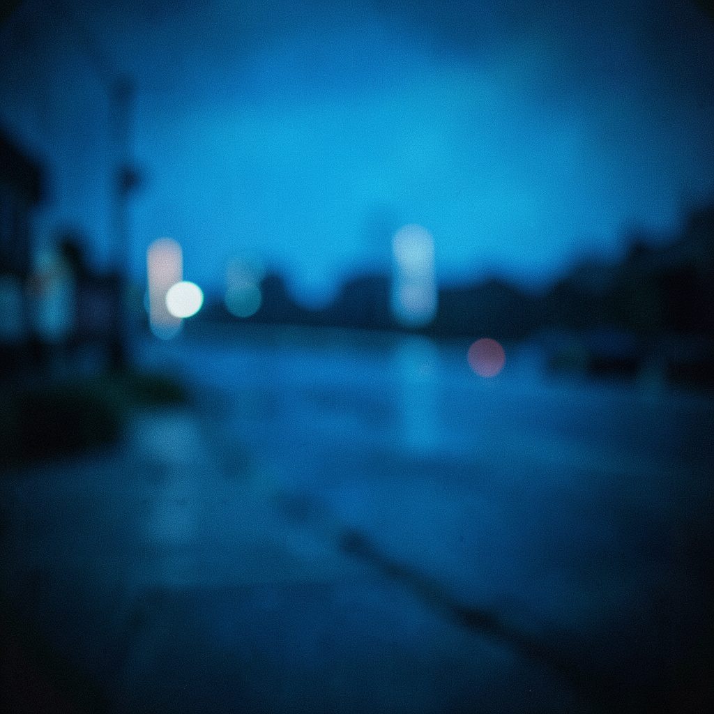Stylized illustration of a glowing blue smartphone with message bubbles, set against a dark navy background with soft light streaks